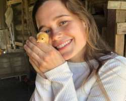 Sarah cuddles and kisses the animals to show her love to them.